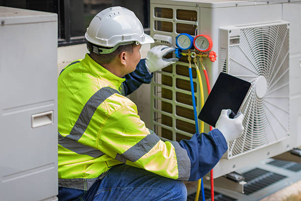 Professional Heat Pump Repair technician working in Aston, PA
